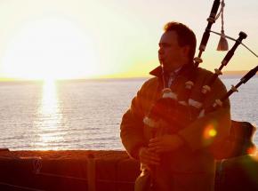 Archie piping at sunset on a winter tour