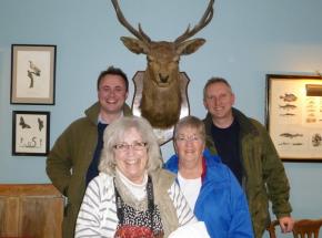 Archie with some clients (and a stag!) near Loch Lomond...