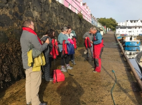 A group getting ready for a sailing trip from Portree on Skye!